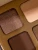 Close-up of INIKA Organic Quad Eyeshadow Palette WIND with matte and softly shimmering brown-beige shades.