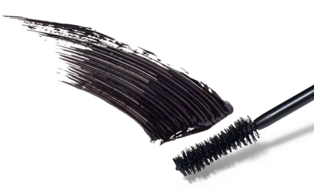 Beyond Lash mascara brush with an even deep black swatch showing creamy texture.