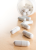 Close-up of smooth white ENVIRON PHARMA Hair, Skin, Nails supplement capsules.