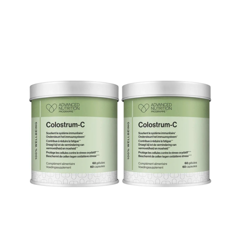Two Advanced Nutrition Programme Colostrum-C tins with green labels for a 2-pack supplement set.