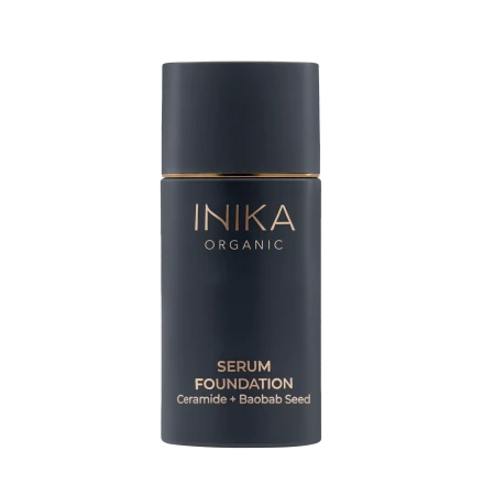 Main INIKA Organic Serum Foundation bottle in dark navy packaging with gold lettering on a white background.