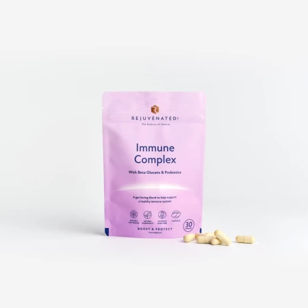 Rejuvenated Immune Complex lavender capsule pack with beige capsules beside it.