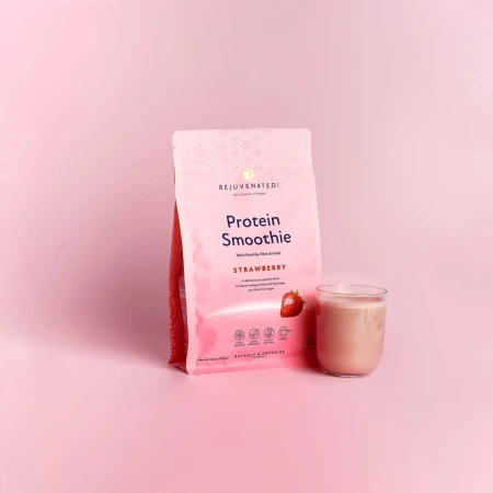 Rejuvenated Protein Smoothie Strawberry pack on a pale pink background with a pink drink.
