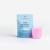 REJUVENATED H3O Hydration Powder sachet with a prepared pink electrolyte drink in a glass