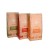 Three SAROOBOS tea flavours arranged one behind another: Green Rooibos, Strawberry and Honeybush.
