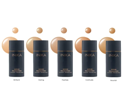 Five INIKA Organic Serum Foundation shades in navy bottles.