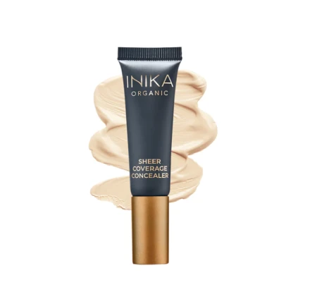 INIKA Organic Sheer Coverage Concealer tube with a light beige swatch on a white background.