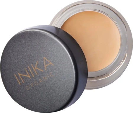 Open INIKA Organic Full Coverage Concealer jar showing the creamy concealer texture.