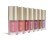 Several Jane Iredale ColorLuxe Liquid Blush tubes with golden caps in shades from nude pink to deeper tones.