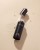 Open INIKA Organic Liquid Nectar Nourish + Prime bottle with pipette on a light background