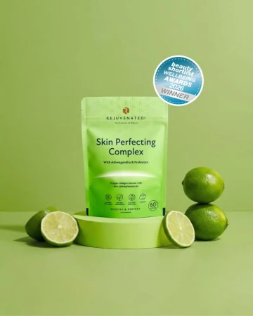 Rejuvenated Skin Perfecting Complex green pack with limes and award badge.