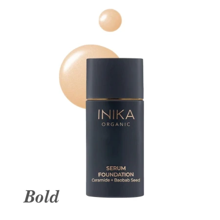 INIKA Organic Serum Foundation in shade Bold with a warm golden-beige liquid swatch.