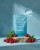 Rejuvenated Collagen Shots pouch on turquoise background with berries and mint