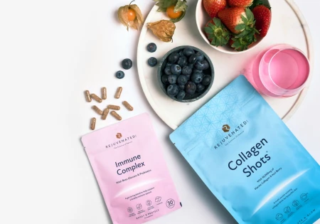 Rejuvenated supplement pouches with berries and drinks on a tray