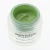 Close-up of an open INSTYTUTUM SuperBiotic Regenerating Cream jar with fresh green silky texture.