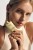 Model holding INSTYTUTUM Sunscription Dark Spot Defence SPF50 tube with applicator visible