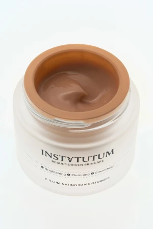 Open jar of INSTYTUTUM C-Illuminating 3D Moisturizer with warm beige cream texture