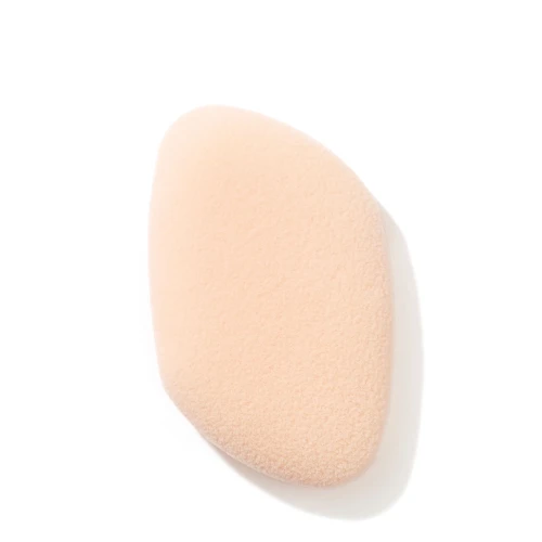 Jane Iredale Flocked Sponge in a soft pale pink shade with ergonomic curved shape.