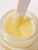 Close-up of INIKA Organic Lip Mask jar with applicator in the smooth formula