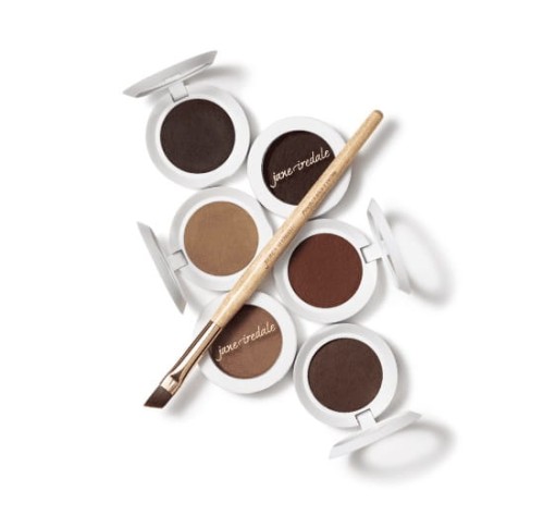 Jane Iredale brow styling powders: five round pots with white lids, opened to show brow powder shades from light beige through warm brown to deep dark brown.