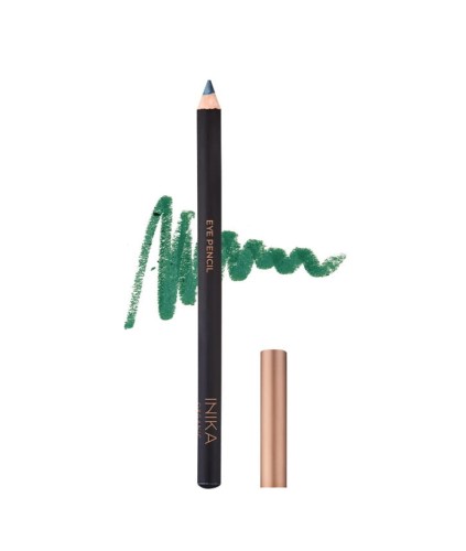 INIKA ORGANIC Eye Pencil with a black barrel and gold lettering. A gold cap lies beside it and an intense green EMERALD color swatch is visible in the background.
