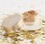 Jane Iredale loose eyeshadow and highlighter in an elegant matte jar with a satin gold lid and the brand logo.